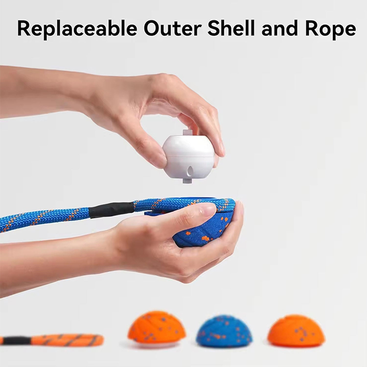 Person holding a white device with a blue rope, showing replaceable outer shell feature.